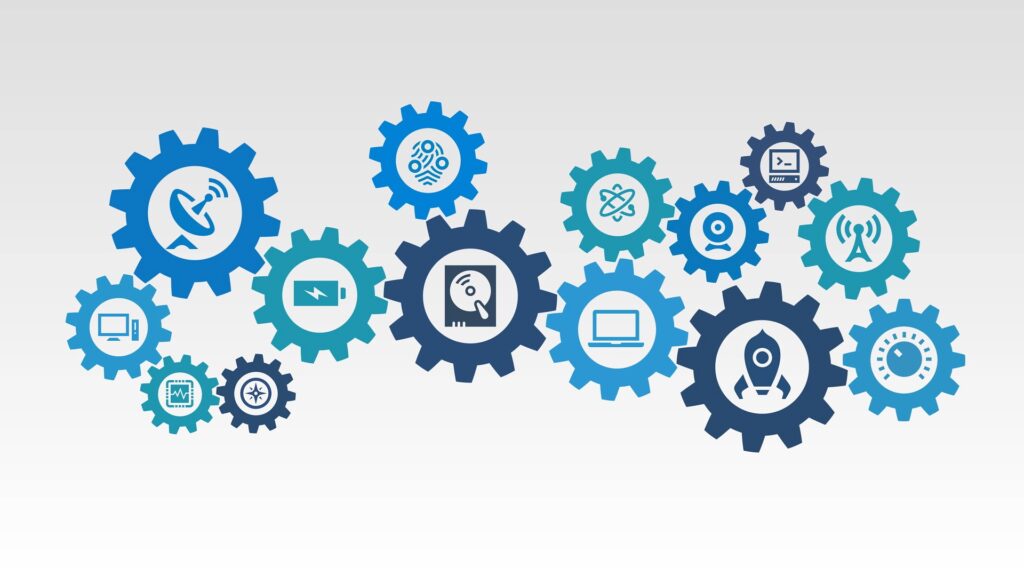 Several simple gears with images of common tech inside of them